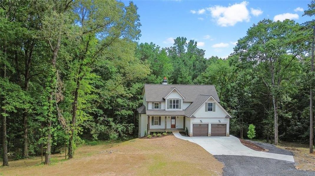Front exterior of a new home in , Canton, GA, highlighting curb appeal (Image 1).