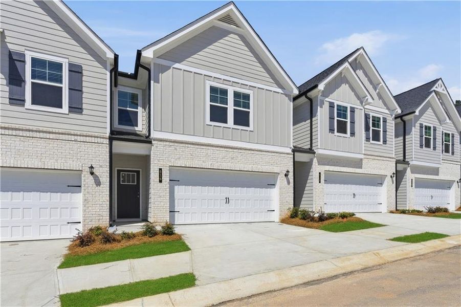 Front exterior of a new home in Diamante, Stockbridge, GA, highlighting curb appeal (Image 13).