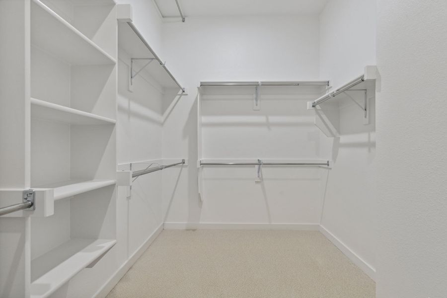 Primary Closet in the Picasso II home plan by Trophy Signature Homes – REPRESENTATIVE PHOTO