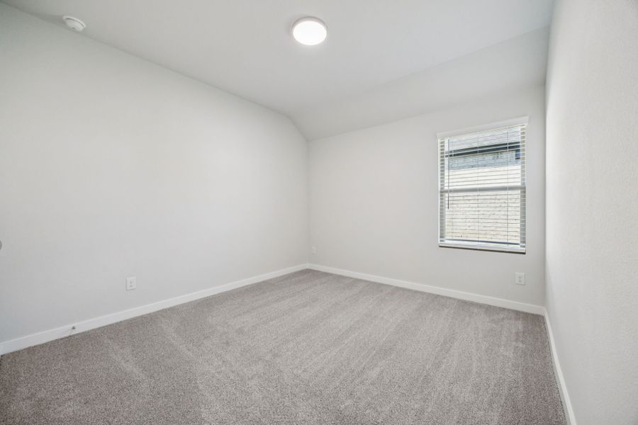 Bedroom in the Heisman home plan by Trophy Signature Homes – REPRESENTATIVE PHOTO Bedroom in the Heisman home plan by Trophy Signature Homes – REPRESENTATIVE PHOTO