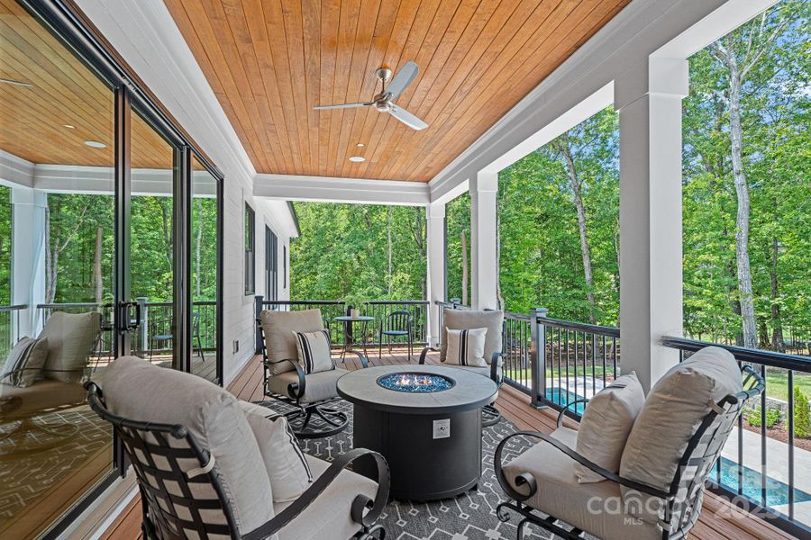 Upper patio overlooking the pool with trex decking.