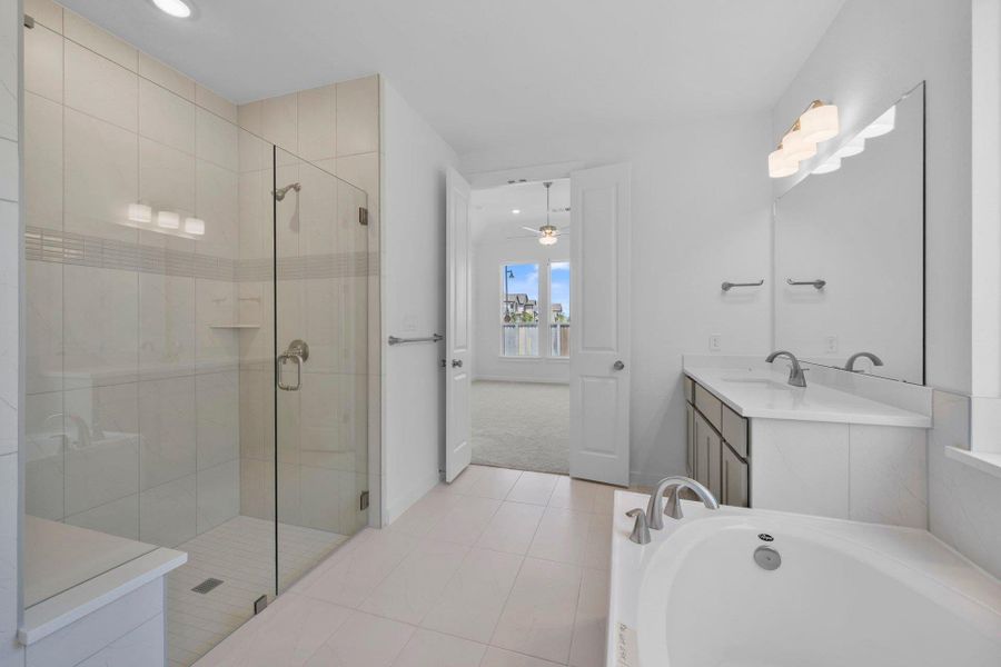 Primary Bath retreat with dual vanities, garden tub & walk-in shower Primary Bath retreat with dual vanities, garden tub & walk-in shower