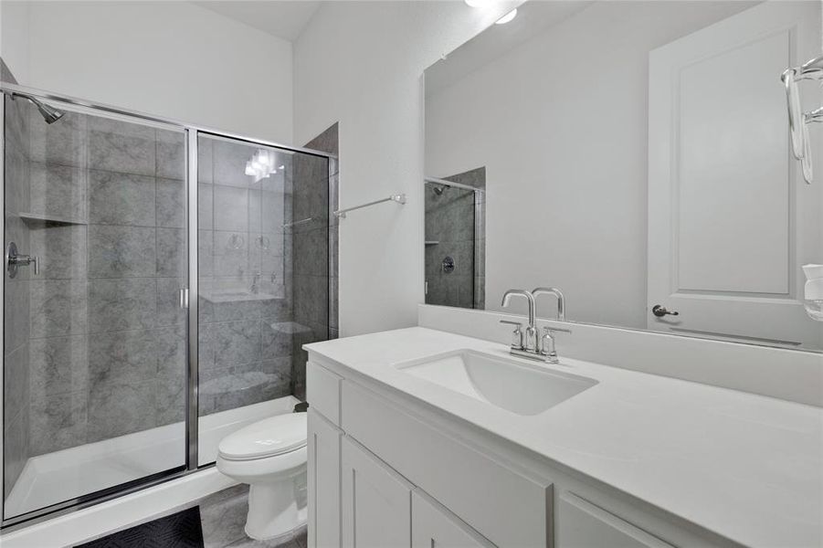 Bathroom with vanity and a shower stall