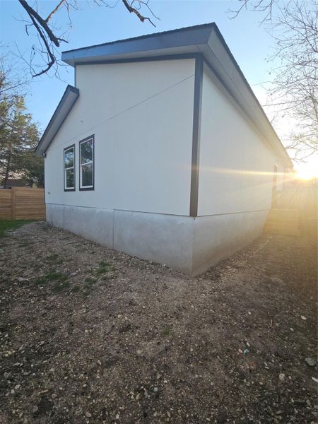 View of property exterior with fence