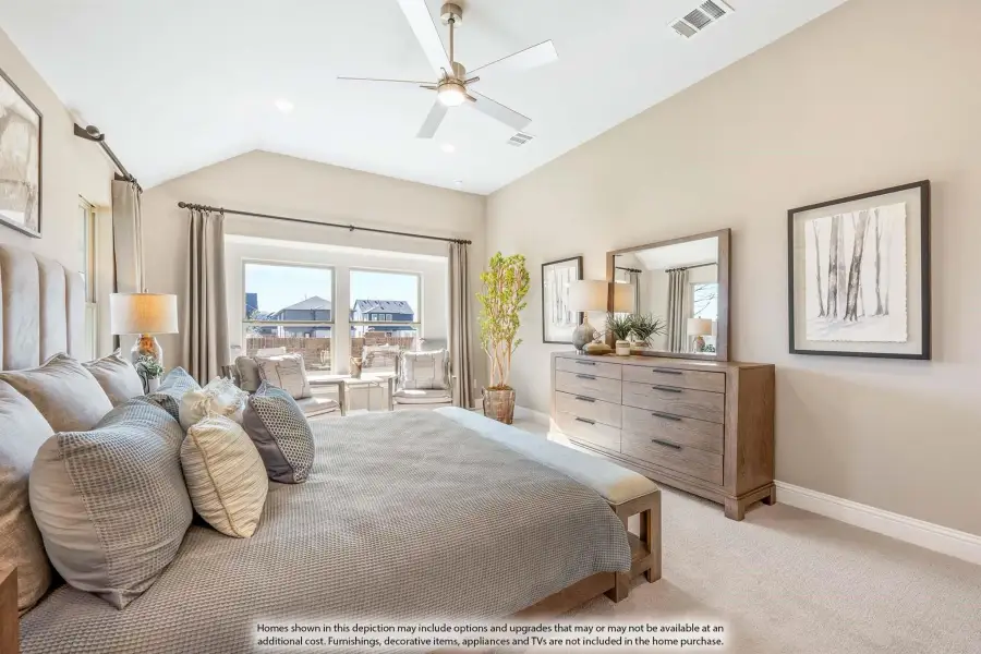 Master bedroom with vaulted ceiling, ceiling fan, wood dresser, and large windows with backyard view