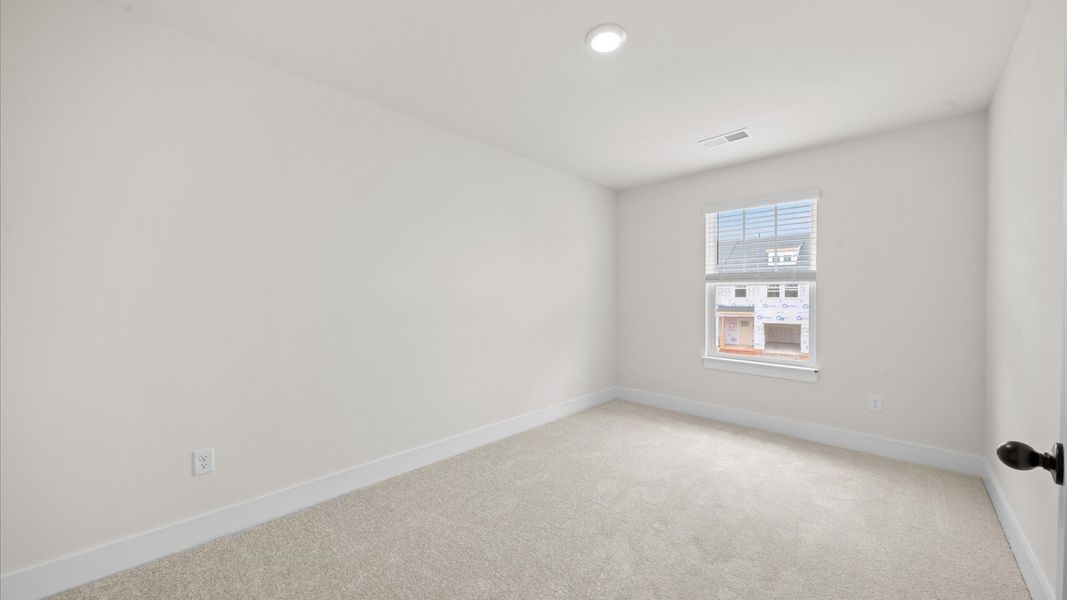 Superior comfort in this light-filled bedroom with plush carpeting and thoughtfully placed large windows Superior comfort in this light-filled bedroom with plush carpeting and thoughtfully placed large windows