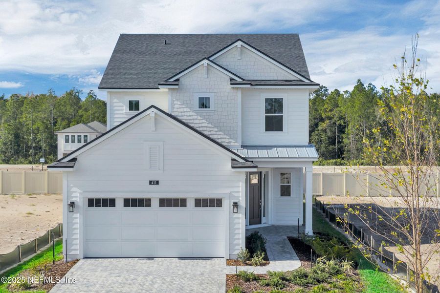 Front exterior of a new home in Seabrook Village at Seabrook, Ponte Vedra, FL, highlighting curb appeal (Image 24).
