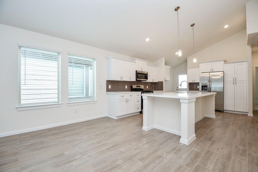 Here is the dining space paired with a gorgeous, spacious kitchen.