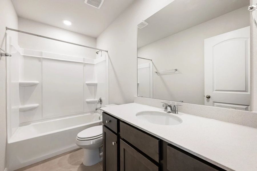 Furnished interior view inside a new home in The Colony, Bastrop (Image 13).