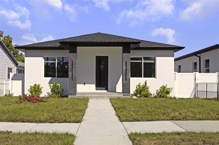 Front exterior of a new home in , St. Petersburg, FL, highlighting curb appeal (Image 1). Front exterior of a new home in , St. Petersburg, FL, highlighting curb appeal (Image 1).