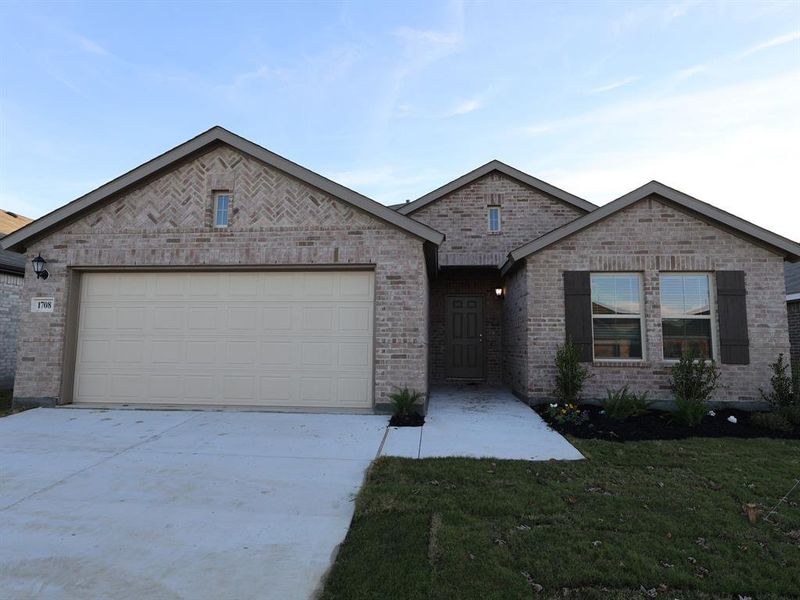 Front exterior of a new home in Sanderos, Fort Worth, TX, highlighting curb appeal (Image 1).