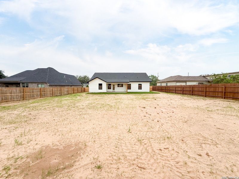 Exterior details and patio area of a home in , Devine (Image 24).