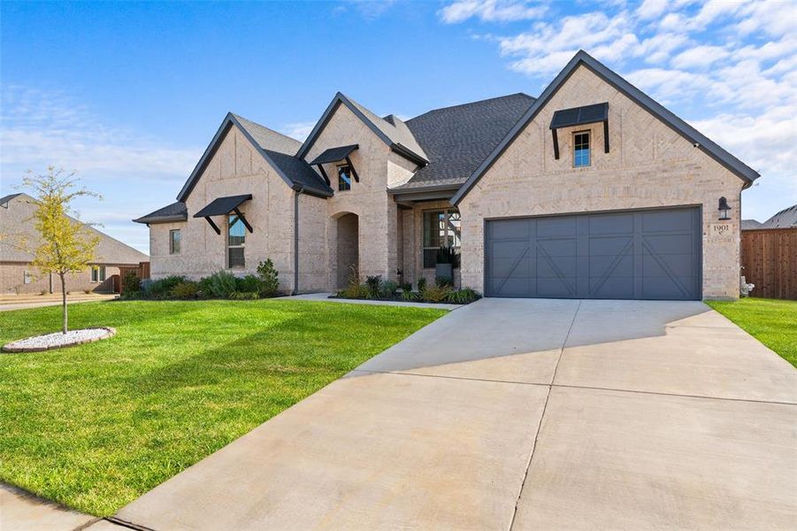 Front exterior of a new home in , Mansfield, TX, highlighting curb appeal (Image 2). Front exterior of a new home in , Mansfield, TX, highlighting curb appeal (Image 2).
