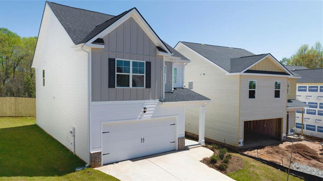 Front exterior of a new home in Shoal Creek, Hampton, GA, highlighting curb appeal (Image 17).