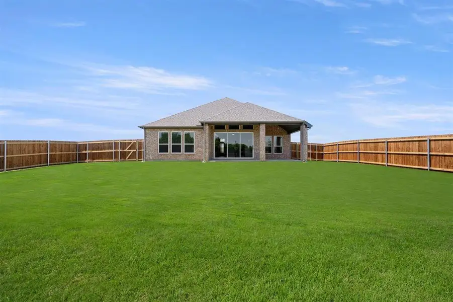 Exterior details and patio area of a home in Oaks of North Grove, Waxahachie (Image 4). Exterior details and patio area of a home in Oaks of North Grove, Waxahachie (Image 4).
