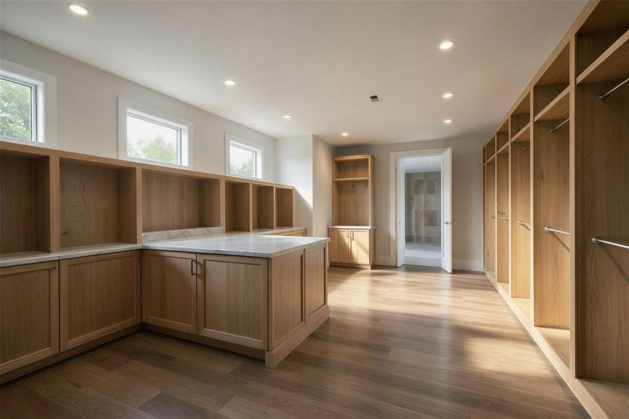 Rendering: Oversized primary closet with custom cabinetry and island.