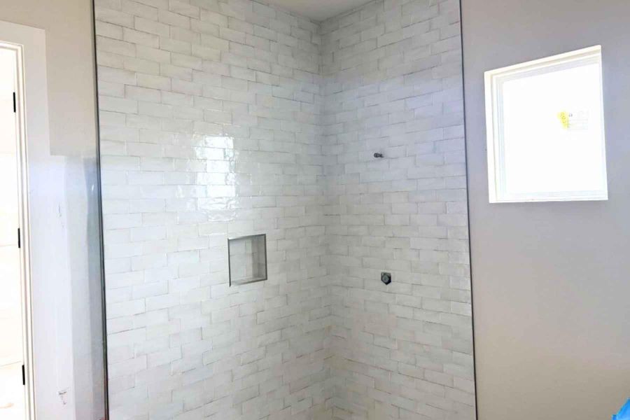 Full bathroom with a shower stall Full bathroom with a shower stall