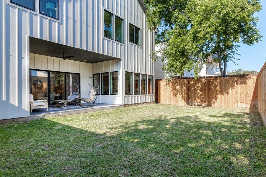 View of yard featuring a patio area and ceiling fan