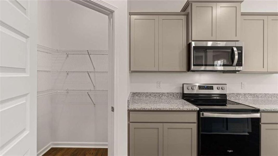 Furnished interior view inside a new home in Oakchase at Hampton, Hampton (Image 9).