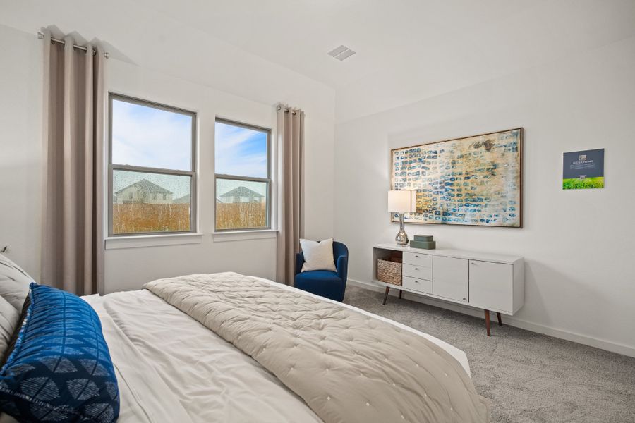 Primary suite in the Oak home plan by Trophy Signature Homes – REPRESENTATIVE PHOTO