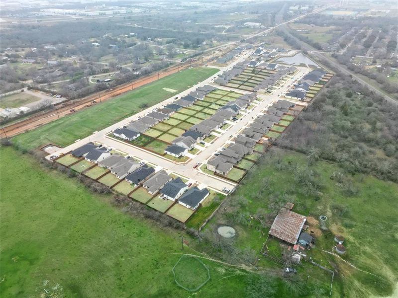 Aerial view of the Courts of Bonnie Brae community in Denton, TX, showing layout and nearby surroundings (Image 12).
