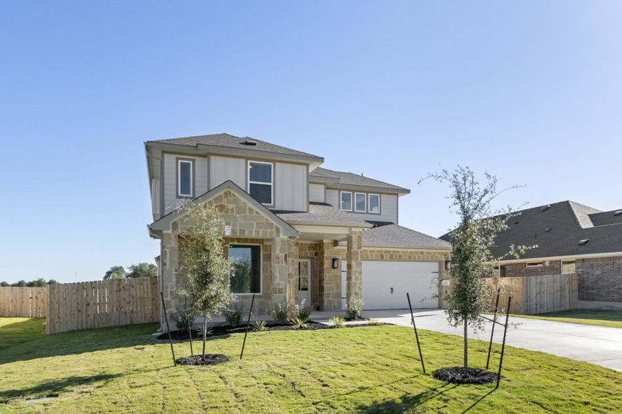 Front exterior of a new home in Grande Estates, Bertram, TX, highlighting curb appeal (Image 28).