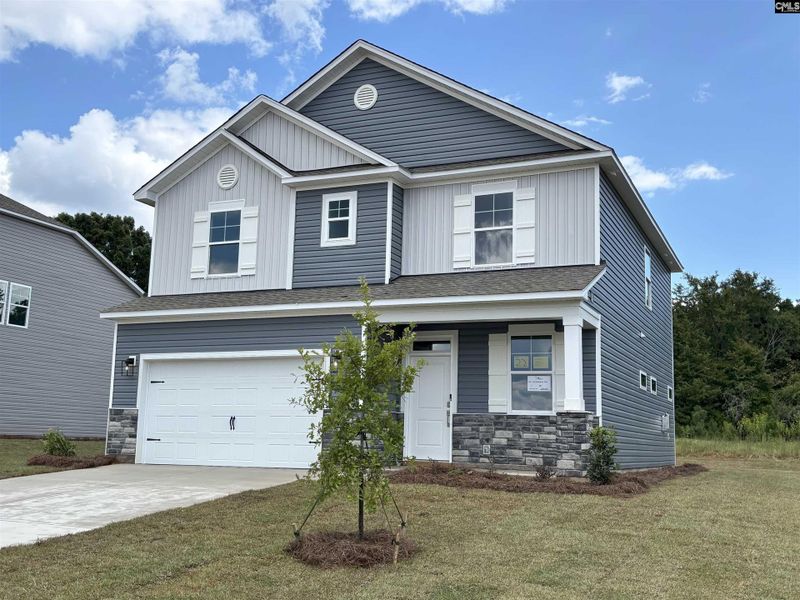 Front exterior of a new home in Rolling Hills, Prosperity, SC, highlighting curb appeal (Image 2).