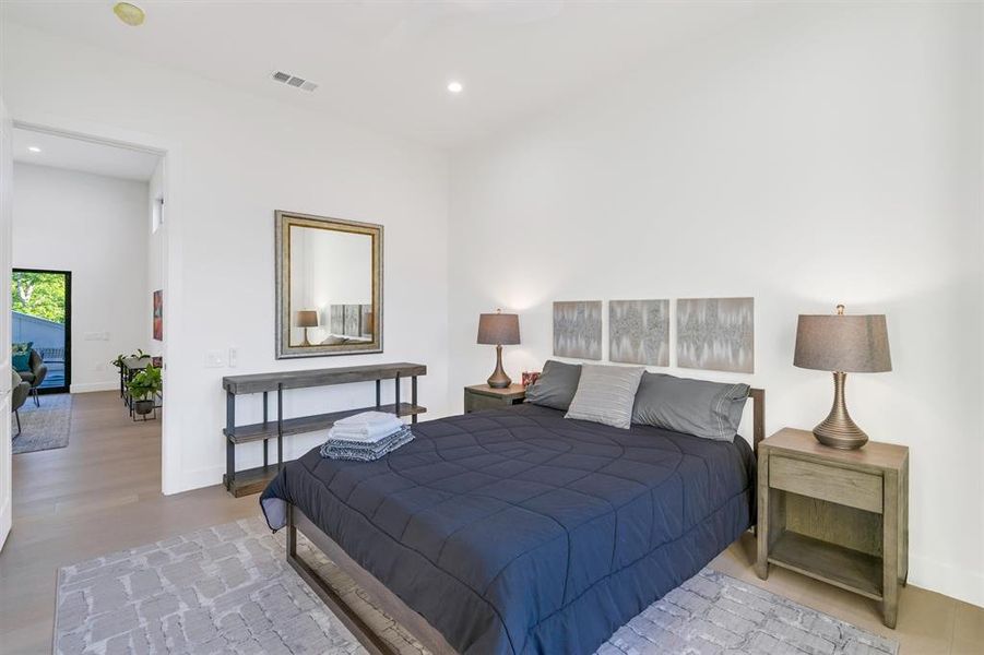 Bedroom with recessed lighting and light wood-type flooring