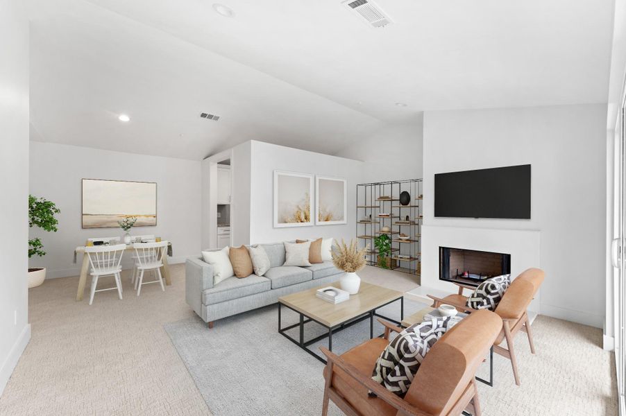 Alternate view of the living room highlighting the high ceilings and natural light. Virtually staged