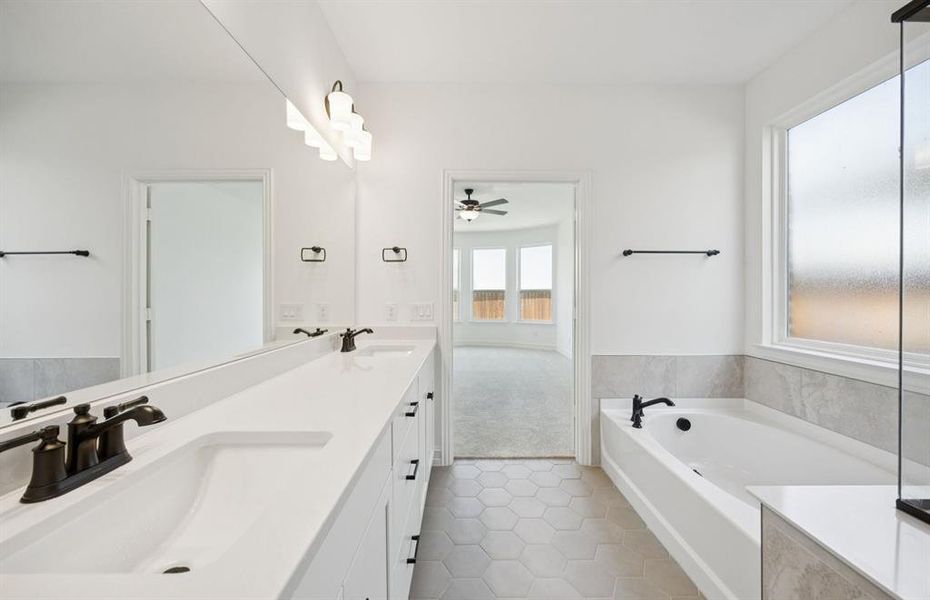 Luxurious owner's bath complete with double sinks and a generous shower *Real home pictured Luxurious owner's bath complete with double sinks and a generous shower *Real home pictured