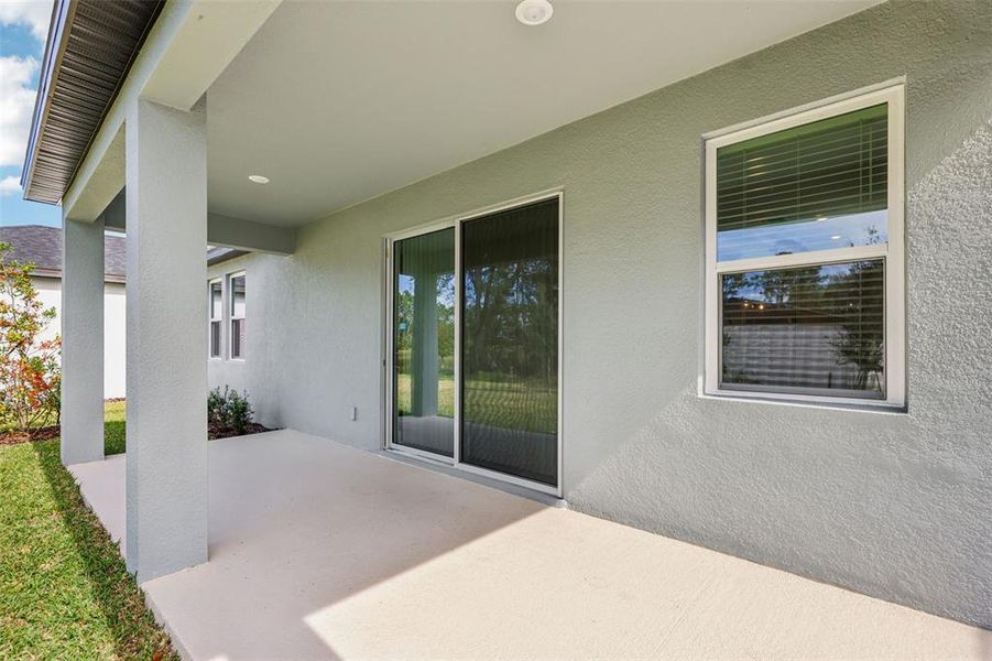 Exterior details and patio area of a home in Ridgehaven - Signature Series, Ormond Beach (Image 27).