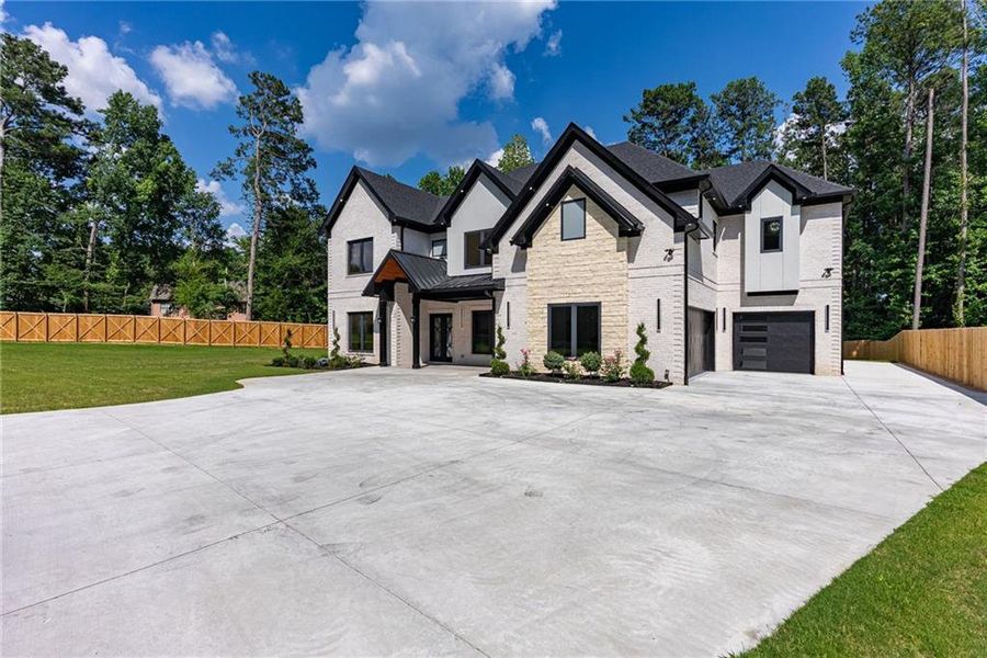 Front exterior of a new home in , Lawrenceville, GA, highlighting curb appeal (Image 46). Front exterior of a new home in , Lawrenceville, GA, highlighting curb appeal (Image 46).
