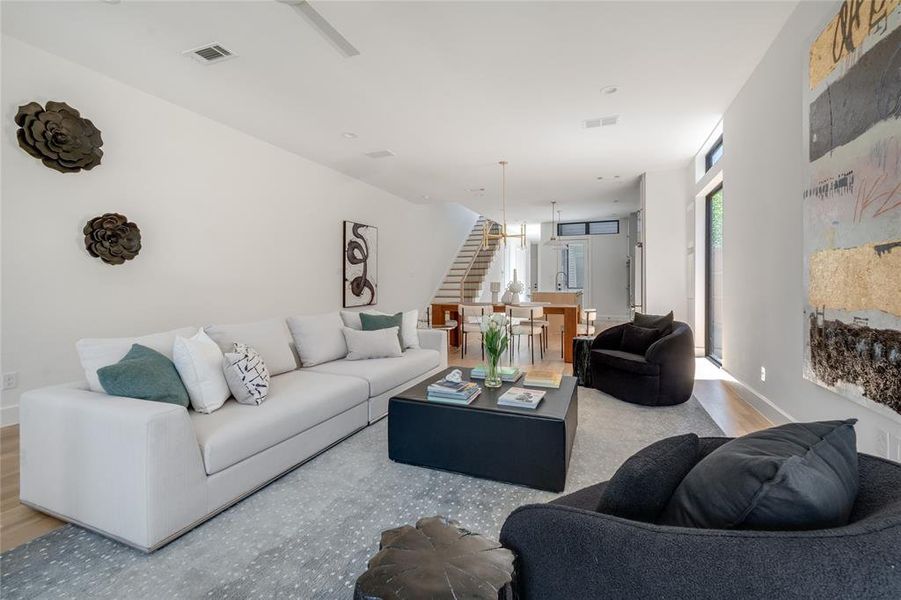 Living room with light hardwood / wood-style floors