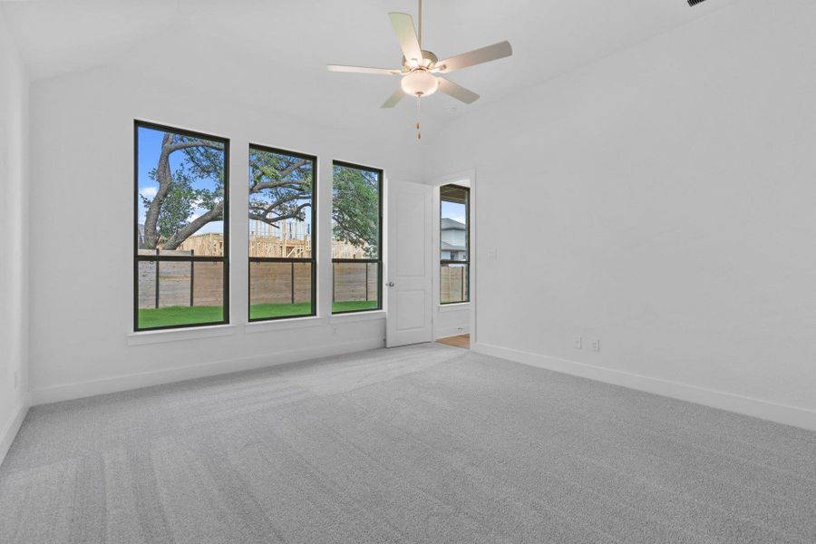 Primary Bedroom with elevated ceiling