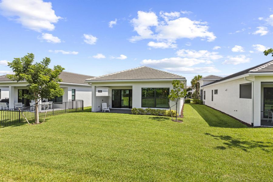 Front exterior of a new home in , The Acreage, FL, highlighting curb appeal (Image 22).
