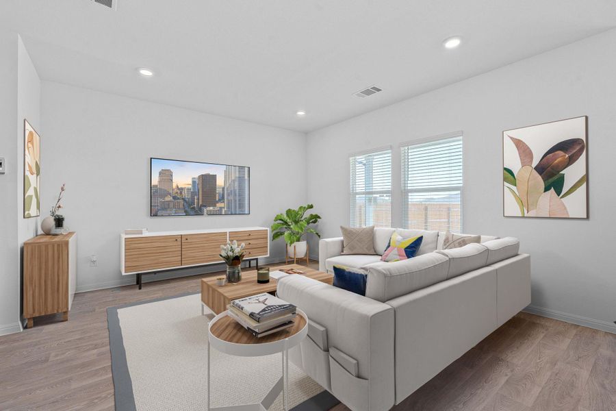 Living room with light wood-type flooring and recessed lighting Living room with light wood-type flooring and recessed lighting