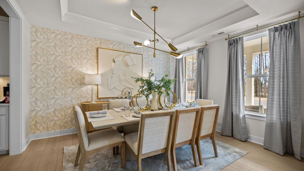 The Stonefield Home Plan in Michaux Garden by DRB Homes in Belmont, NC. - Dining Area featuring coffered ceilings