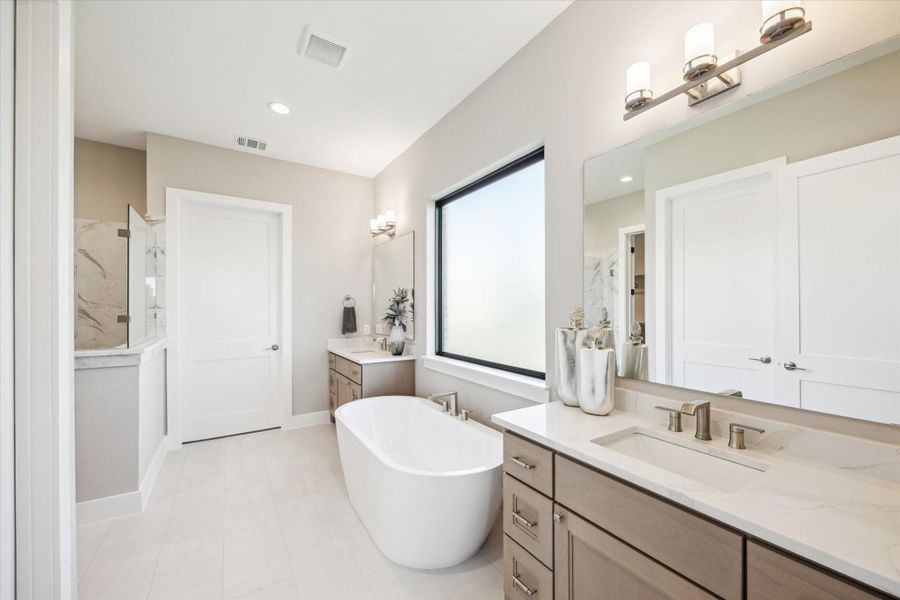 Primary Bath has separate vanities, soaking bath tub, and walk-in shower. Primary Bath has separate vanities, soaking bath tub, and walk-in shower.