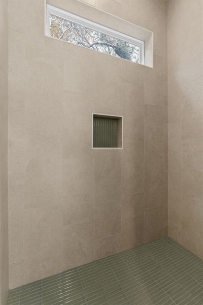 Bathroom with a tile shower and healthy amount of natural light Bathroom with a tile shower and healthy amount of natural light