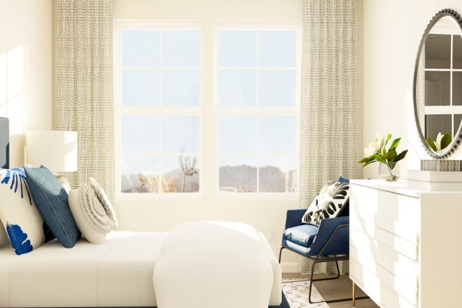 A room with a white couch and a window with a view of the city.