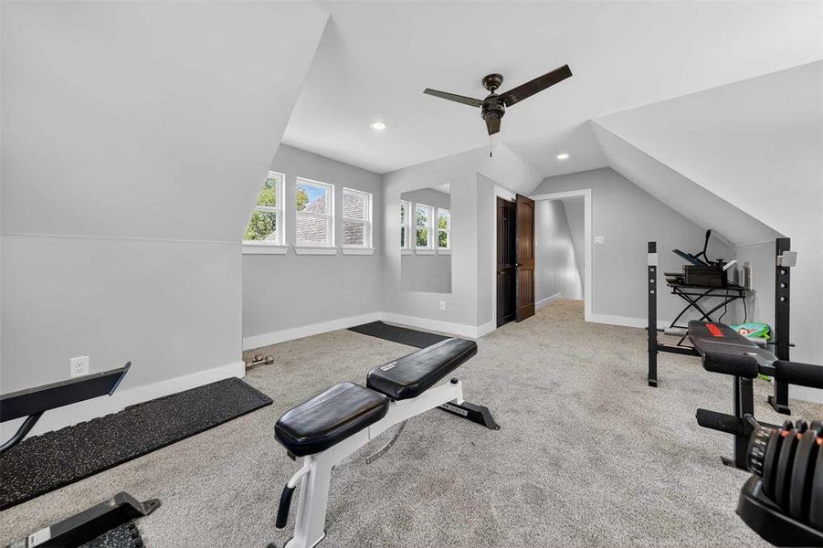 Workout room featuring light carpet, lofted ceiling, ceiling fan, and recessed lighting Workout room featuring light carpet, lofted ceiling, ceiling fan, and recessed lighting