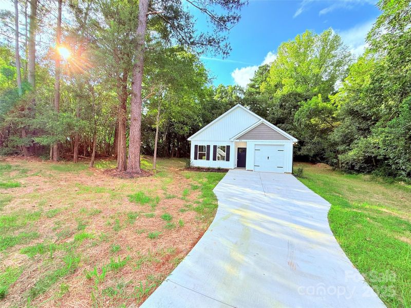 Front exterior of a new home in , Norwood, NC, highlighting curb appeal (Image 24).