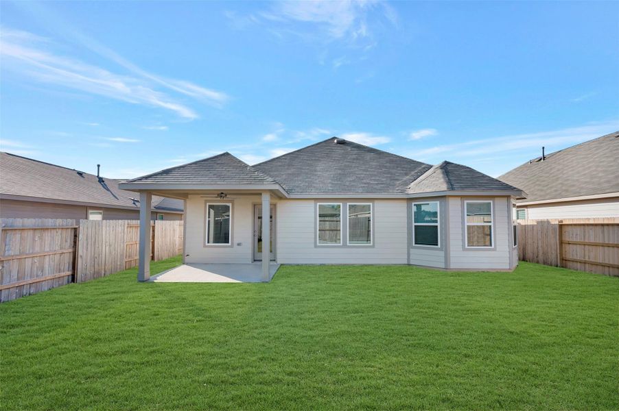 Exterior details and patio area of a home in Pinewood at Grand Texas, New Caney (Image 20).