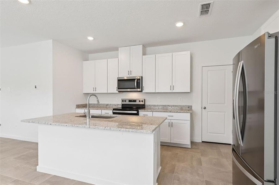 Furnished interior view inside a new home in Flagler Village - Classic Series, Palm Coast (Image 10). Furnished interior view inside a new home in Flagler Village - Classic Series, Palm Coast (Image 10).
