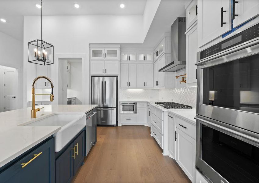 The kitchen has stainless-steel KitchenAid appliances.