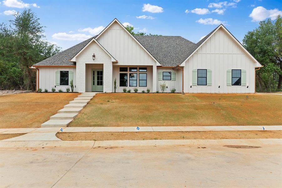 Front exterior of a new home in , Lindale, TX, highlighting curb appeal (Image 25).
