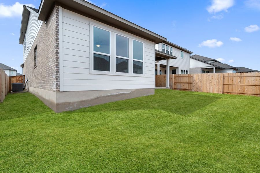 Exterior details and patio area of a home in Arbor Collection at Lariat, Liberty Hill (Image 30).