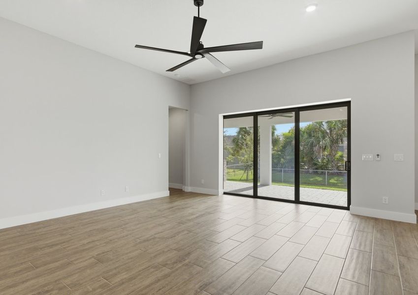 Large family room with a sliding wall of windows. Large family room with a sliding wall of windows.