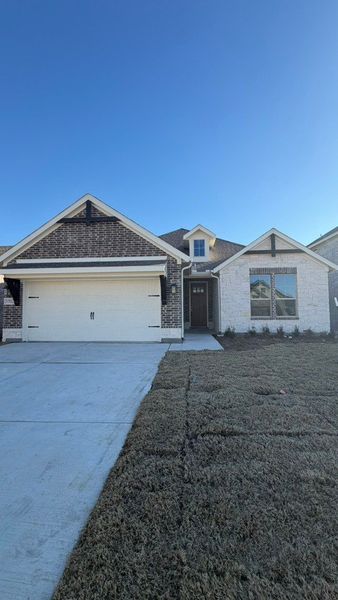 Front exterior of a new home in Liberty Pointe, Gainesville, TX, highlighting curb appeal (Image 10). Front exterior of a new home in Liberty Pointe, Gainesville, TX, highlighting curb appeal (Image 10).