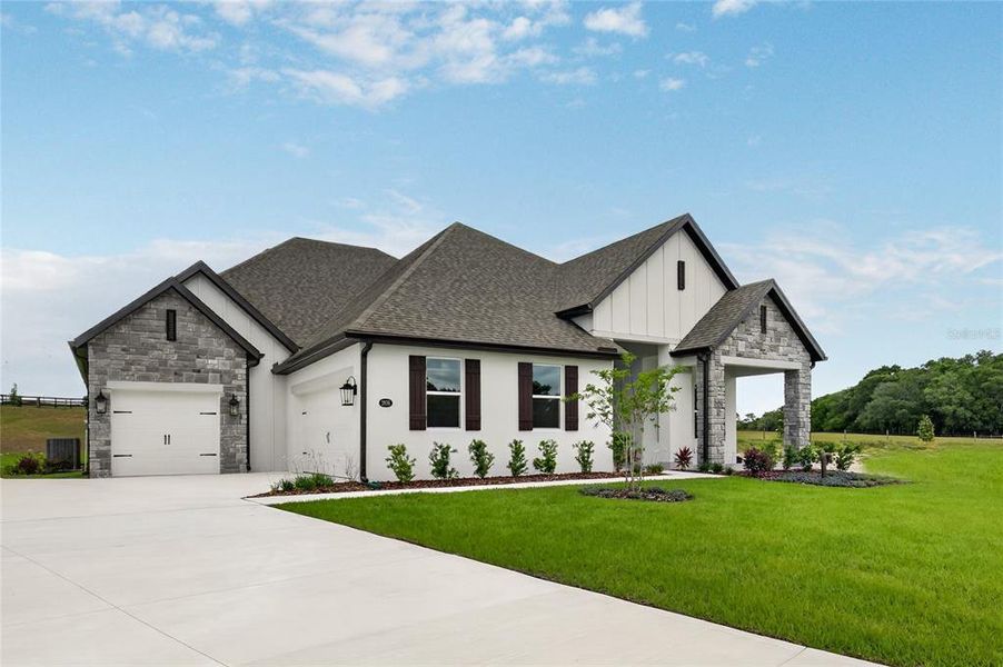 Front exterior of a new home in , Fruitland Park, FL, highlighting curb appeal (Image 29).